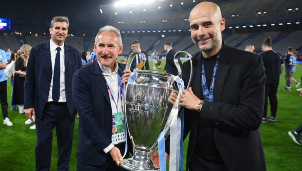Txiki-Begiristain-holds-the-Champions-League-trophy-while-with-Pep-Guardiola-symbol-of-Manchester-Citys-13-year-golden-era